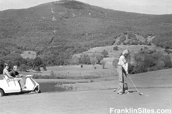 A 1976 photo of a golfer with the Greylock Glen ski area in the background