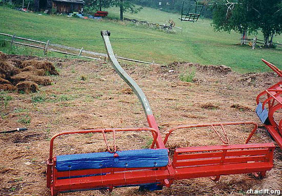 A center pole quad chair after triple chairs were hung